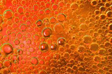 abstract light orange background with oil circles . oil bubbles of water close up. fiery circle...