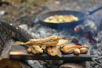 The preparation of the fish caught on fire.
