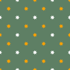 Seamless cute Halloween pattern with small orange white stars on earthy green background. Elegant holiday print for fabric textile gift paper scrapbook wallpaper kids crafts