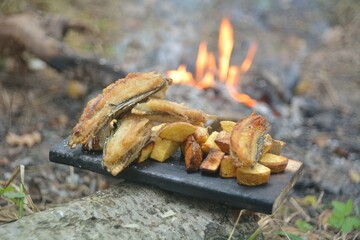 The preparation of the fish caught on fire.
