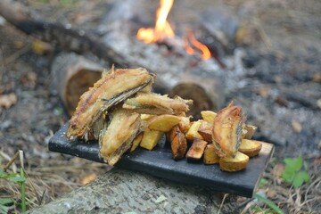 The preparation of the fish caught on fire.
