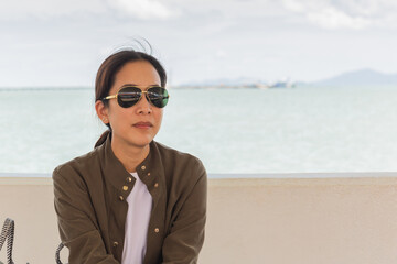 Fashion portrait of asian woman with sunglasses on summer vacation.