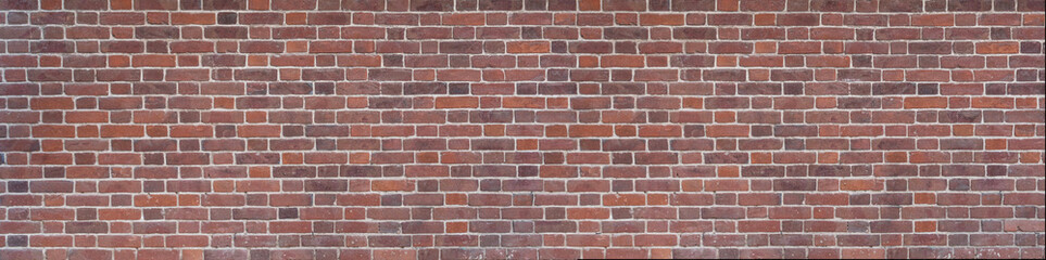 Panoramic background of wide old red brick wall texture.