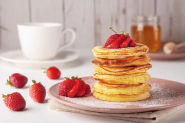 Delicious, only baked pancakes with fresh aromatic strawberries