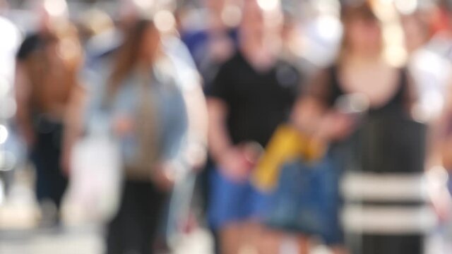 Defocused crowd of people, road intersection crosswalk on The Strip of Las Vegas, USA. Anonymous blurred pedestrians on walkway in crowded urban downtown. Unrecognizable american citizens in sin city.