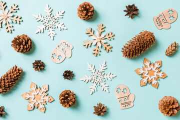 Top view of holiday toys and decorations on blue Christmas background. New Year time concept