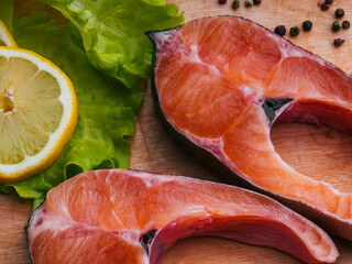 fillet of fresh red fish trout cut into slices on a wooden Board