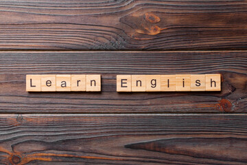 learn english word written on wood block. learn english text on table, concept