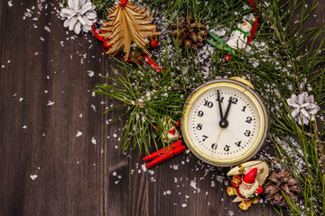Naklejka na ściany i meble Five minutes to midnight. New Year concept. Alarm clock, pine branch, Christmas decorations