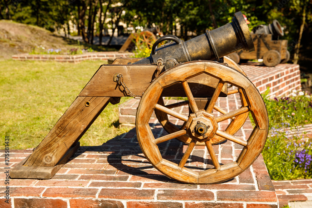Aufkleber old cannon stands in the park in summer. horizontal frame