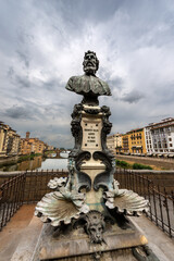 Fototapeta na wymiar Florence, Ponte Vecchio (Old Bridge), Monument (1901) with a Bust of Benvenuto Cellini, famous Florentine sculptor and goldsmith, Tuscany Italy, Europe
