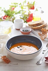 Pumpkin soup with pumpkin seeds.  Selective focus