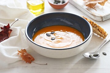 Pumpkin soup with pumpkin seeds.  Selective focus
