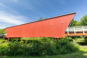 Fototapeta na wymiar An Old Red and White Covered Bridge.