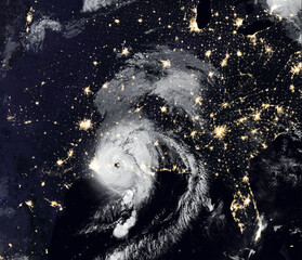 Storm Laura over USA at night, view of tropical hurricane eye from space. Elements of this image...
