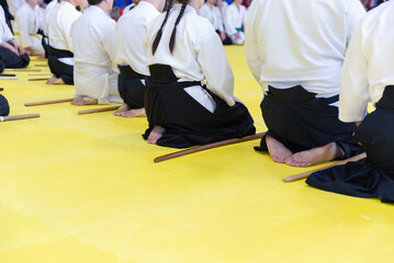 Fototapeta premium People in kimono on martial arts weapon training seminar