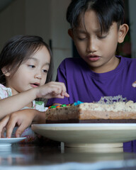 Happy family with three sibling celebrating birthday in quarantine time, self-isolation and family values, stay home, restriction movement order birthday party