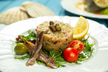 tartar spread with fish, anchovies and vegetables