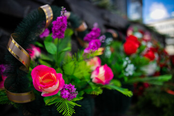 Flowers lie on a granite monument, laying flowers on the day of remembrance and mourning.