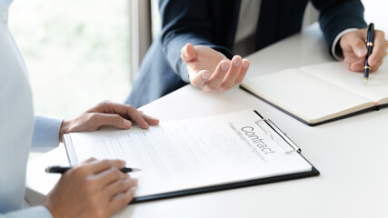 Business lawyer with sign contract in office.