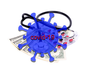 The COVID-19 pandemic. Background concept.Heap of dollars ,medicines with stethoscope