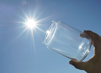 concept to catch your happiness. concept caught the sun. the sun in the hands of the man.