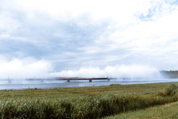 Combined heat and power plant and a lake with cooling fountains. CHP for the production and supply...