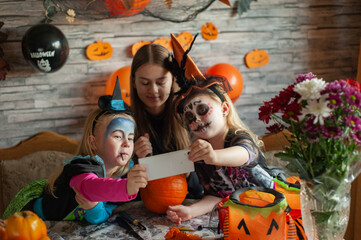 Children dressed in costumes celebrate Halloween