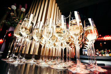 champagne glasses with luxury light on the table ready to be served to guests at an event