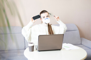 girl works masked during quarantine