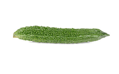 uncooked whole fresh bitter gourd on white background