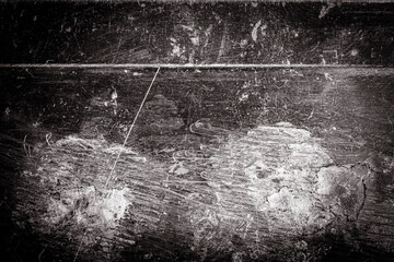 Scratched dirty dusty copper plate texture, black and white image.