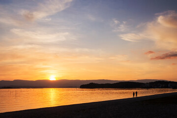 Strolling on the beach at sunset