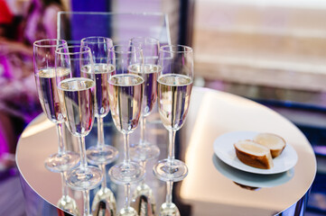 Champagne glasses on gold background. Party and holiday celebration concept.