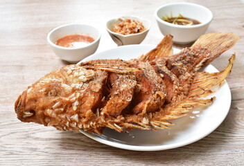 batter fried mango or red Tilapia fish with chop garlic dipping spicy and soy sauce