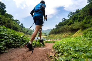 runner, he's running a trail. In the mountain nature trail