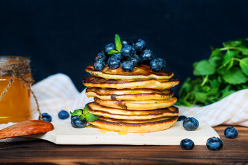 Pancakes with fresh blueberries and honey