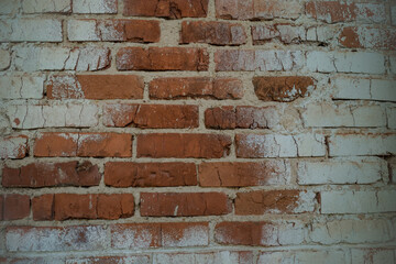 Rough aged masonry background. Backdrop of old red and white bricks with shabby texture