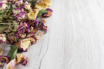 bouquet dried roses on old wood background with copy space