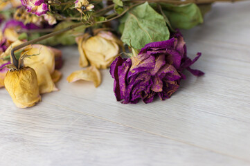 bouquet dried roses on old wood background with copy space