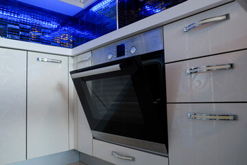 Modern black induction stove. Energy efficient electric built-in oven at home kitchen . Close up,...