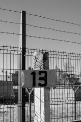 Number 13 on the plate on the pole.