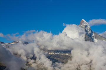 Fototapeta na wymiar Matterhorn mountain cloudscape, Zermatt, Switzerland (summer)