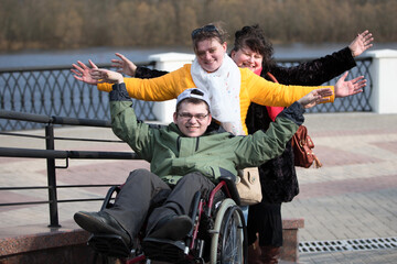 A man with his family in a wheelchair