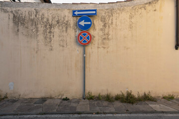 Several Traffic signs on old wall