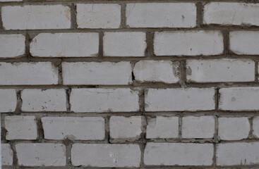 Light wall, white brick with dark seams, texture background