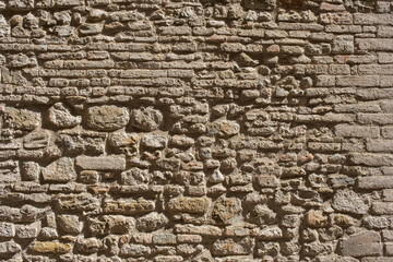 Weathered stained old brick wall background