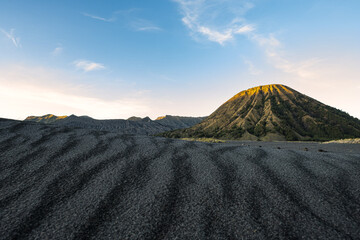 (Selective focus) Stunning view of the Mount Bromo crater illuminated during a beautiful sunrise....
