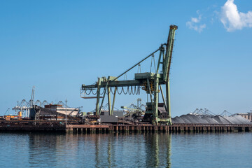 Fototapeta na wymiar Coal terminal wih big industrial cranes for handling coal transportation on the Maasvlakte in the port of Rotterdam