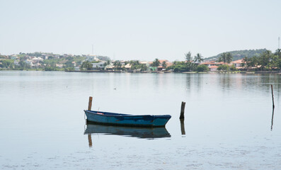Fishing boat in the waters of the lagoon of the coconut grove.